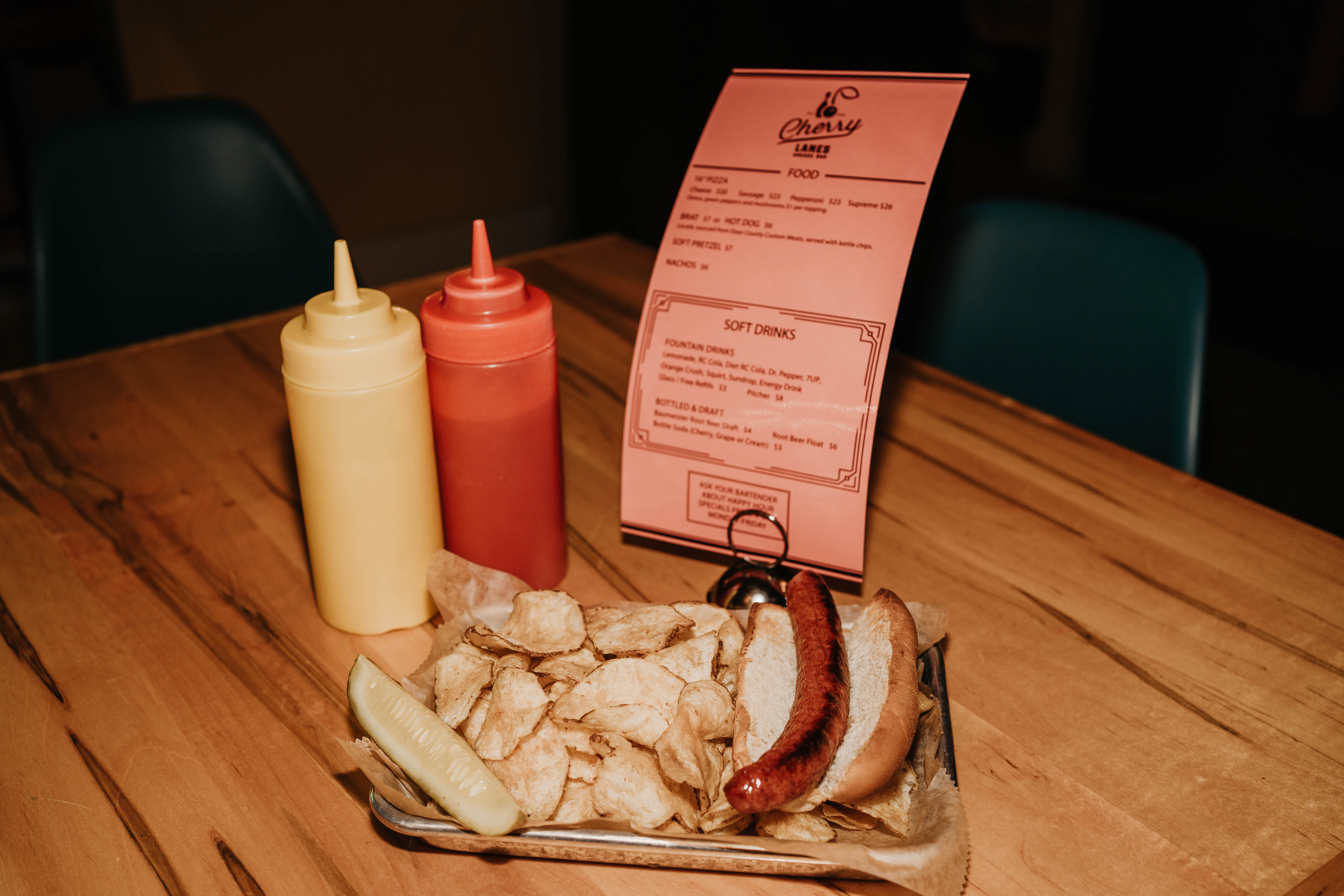 Hotdog with chips, ketchup and mustard